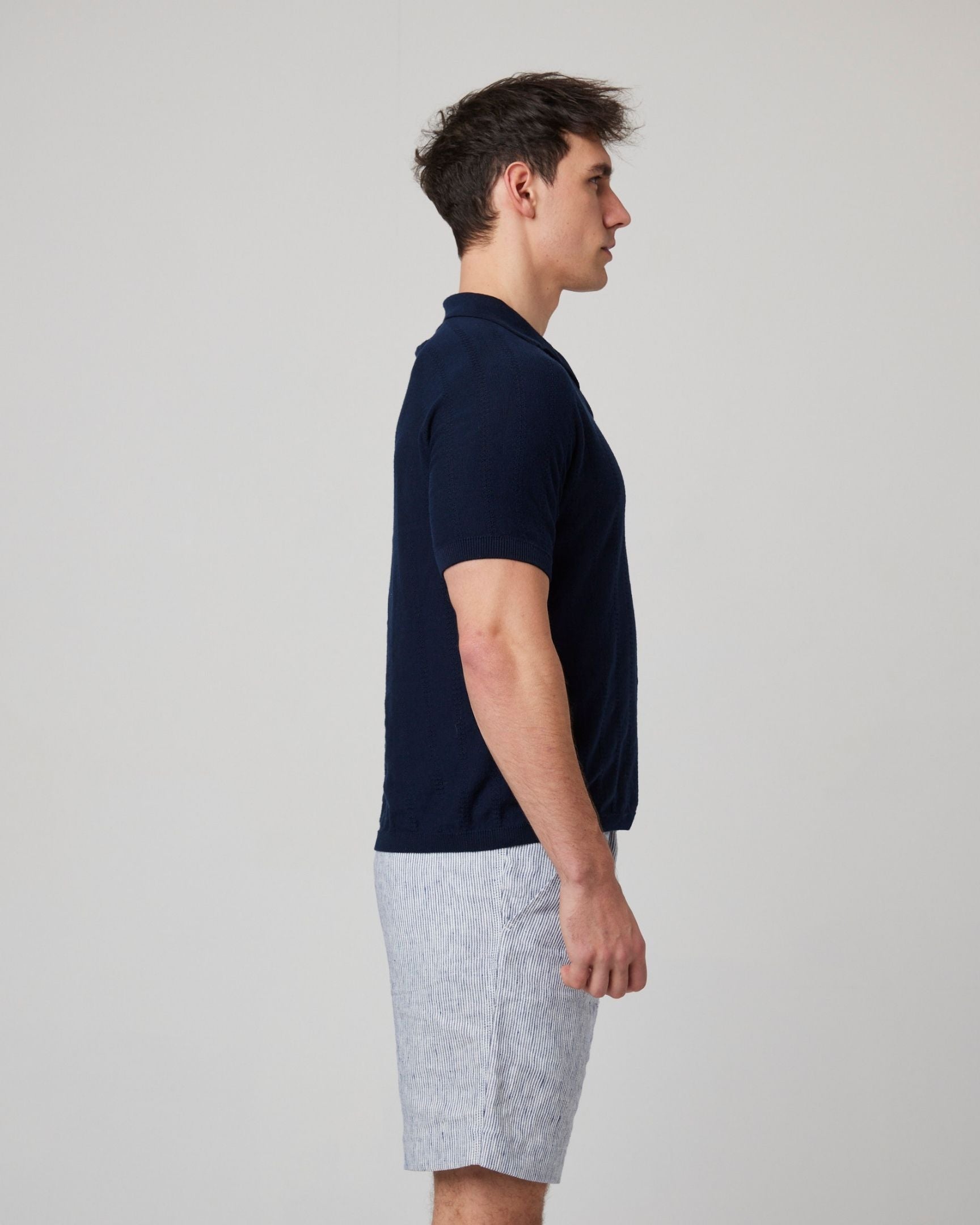 Image of model wearing Alma Polo shirt. 