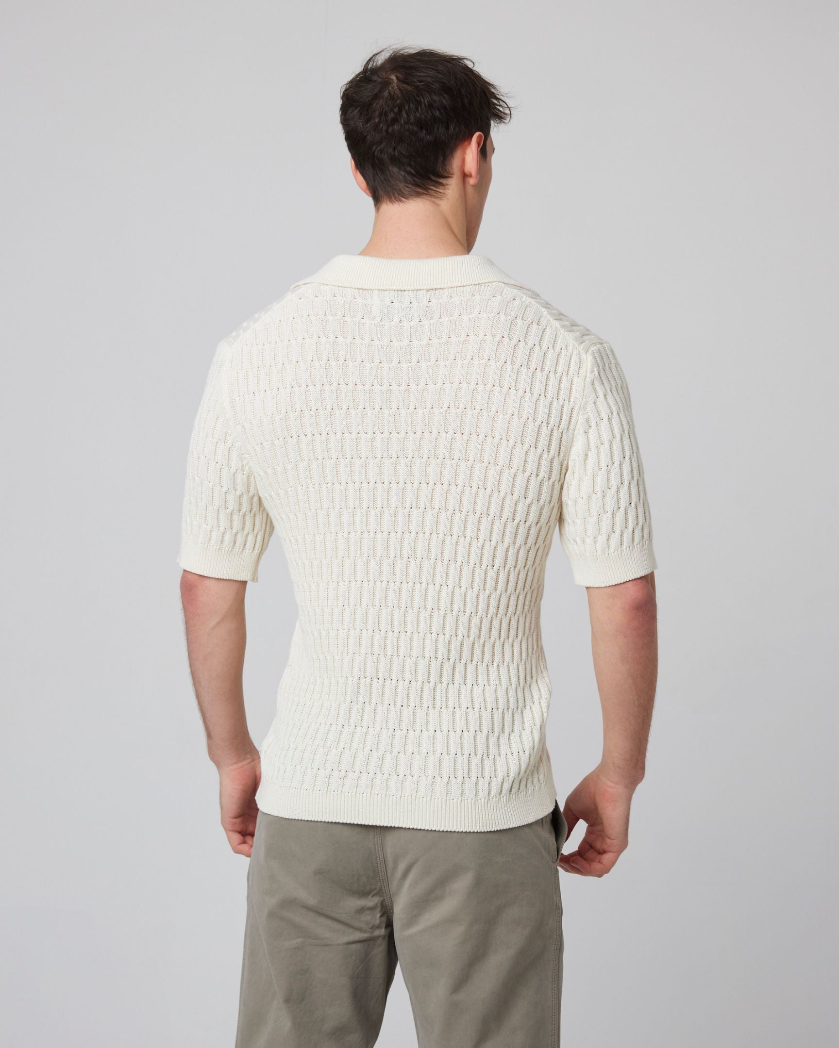 Image of model wearing Cove Polo Shirt. 