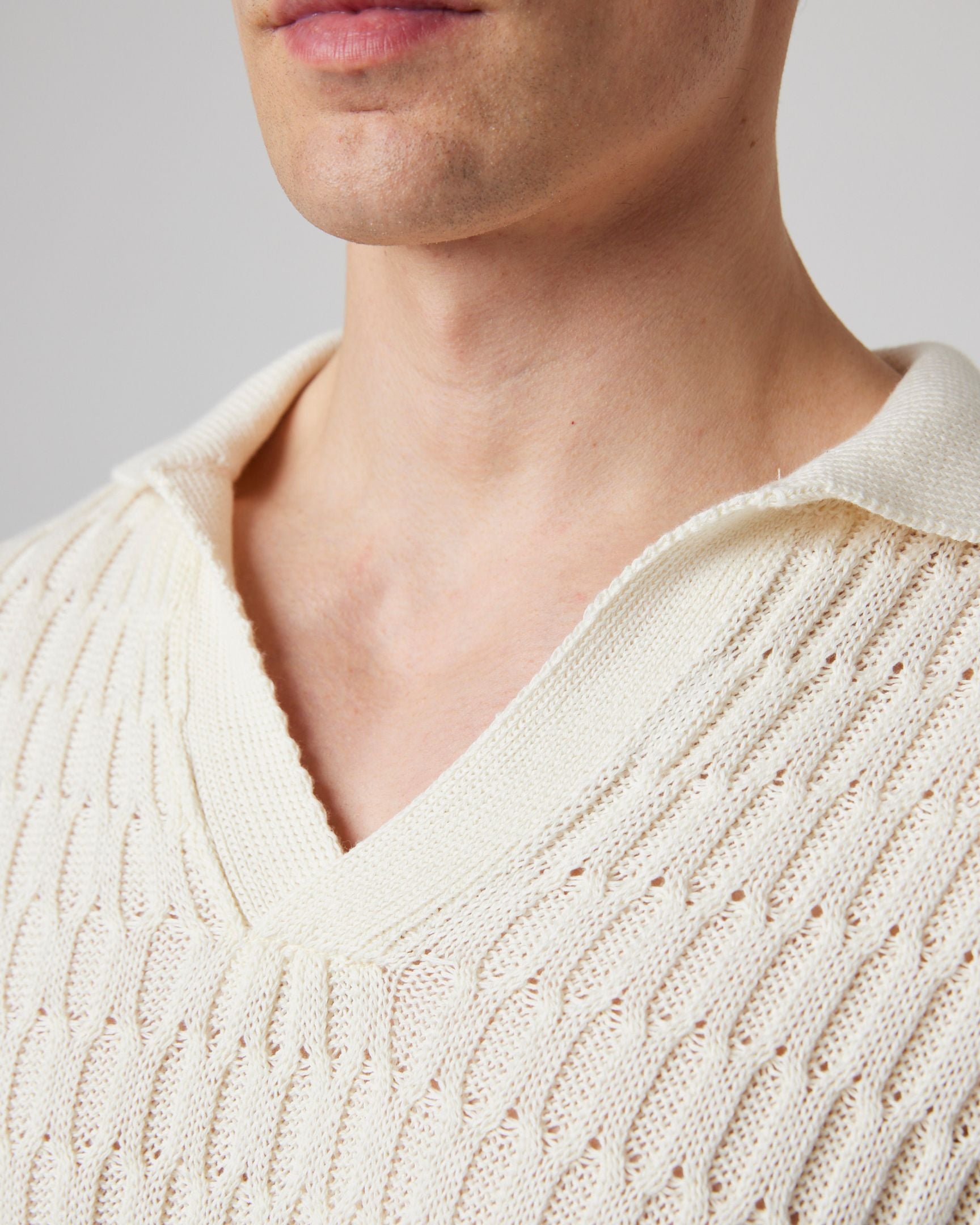 Image of model wearing Cove Polo Shirt. 