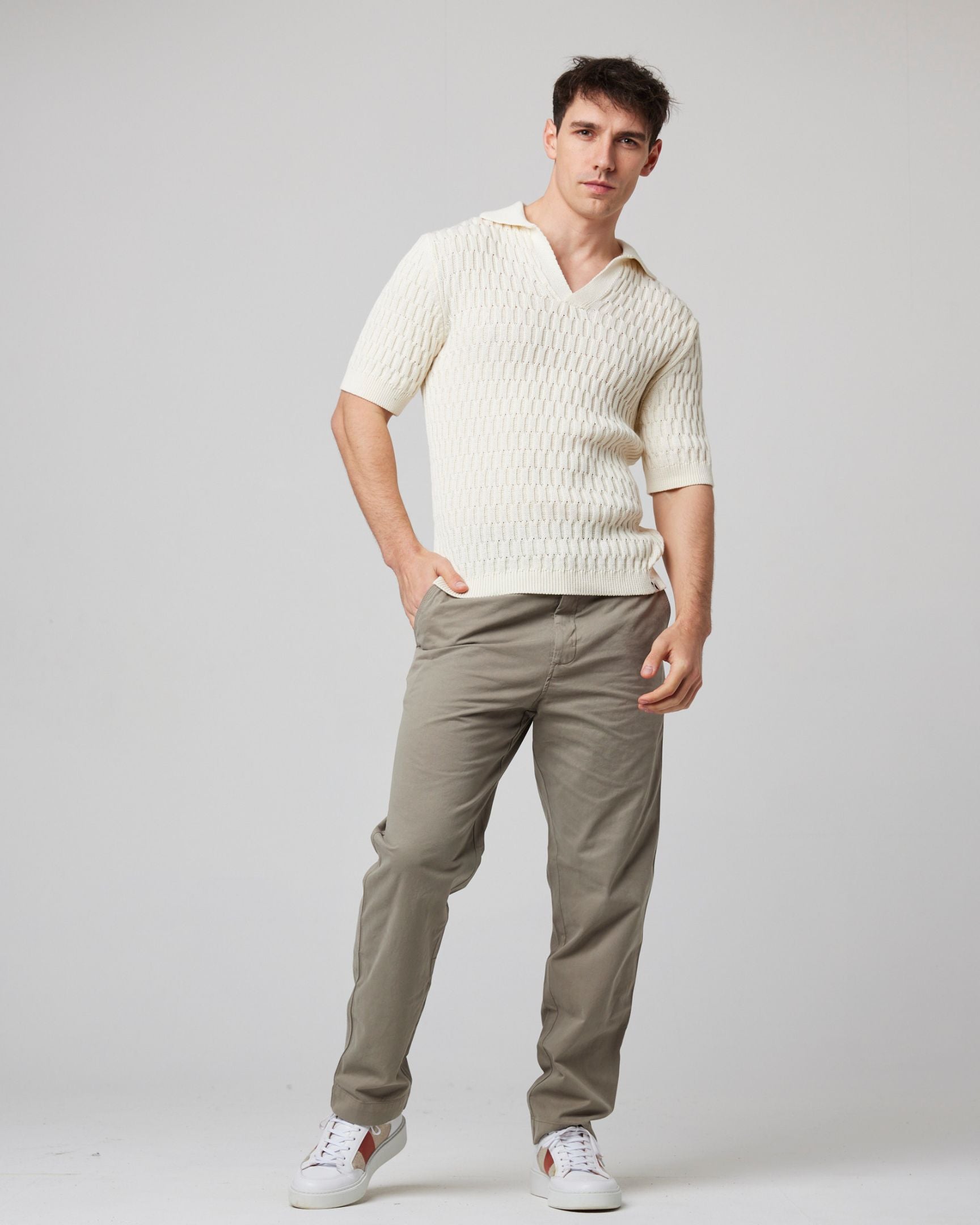 Image of model wearing Cove Polo Shirt. 