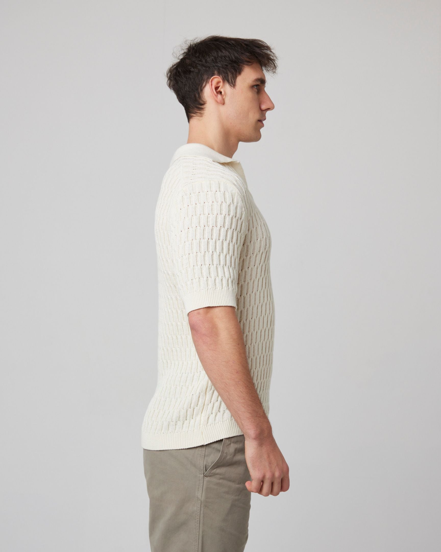 Image of model wearing Cove Polo Shirt. 