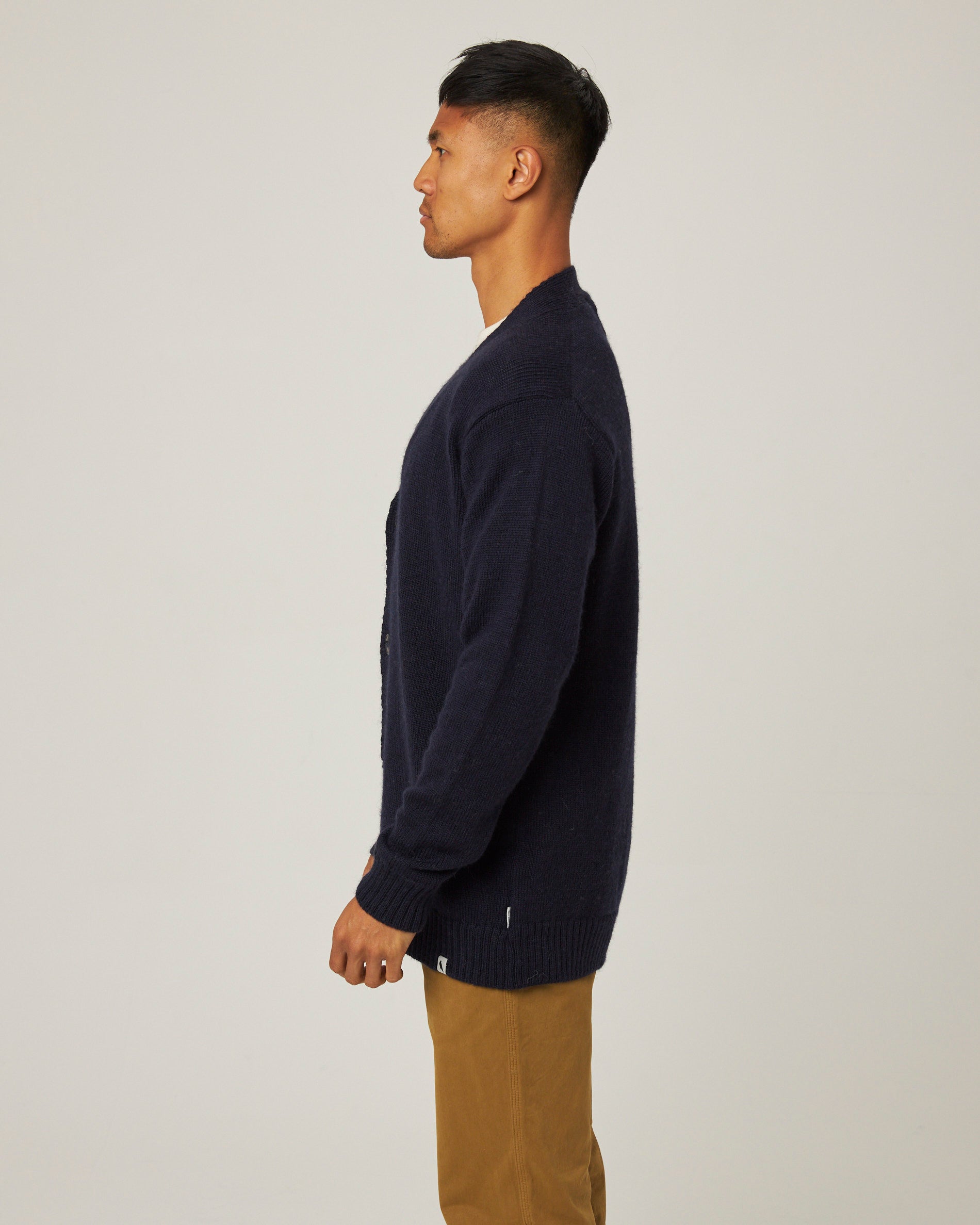 Image of model wearing Makers Stitch Cardigan. Model is 6ft1in, chest size 38in and wearing size Large