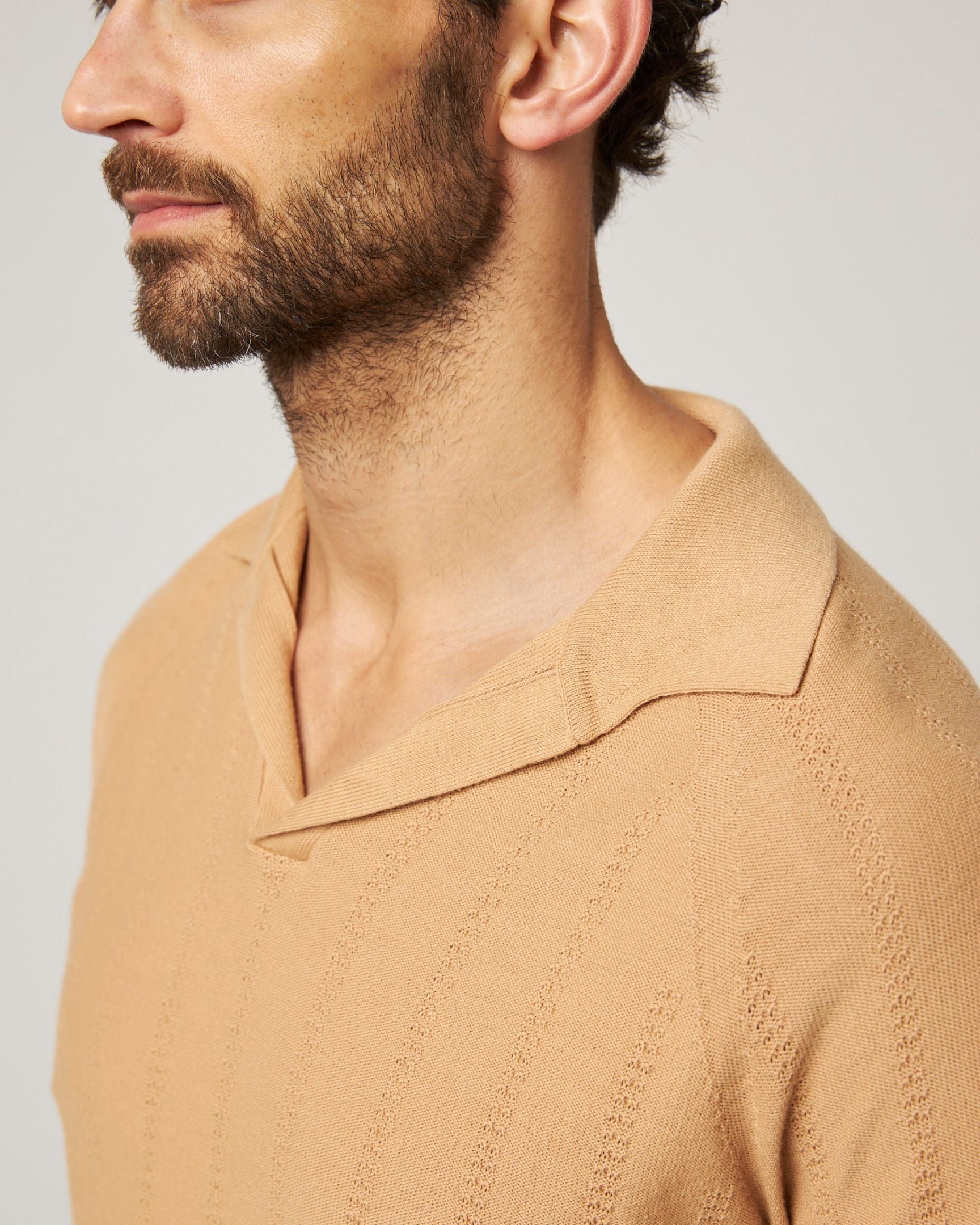 Image of model wearing Alma Polo shirt. 