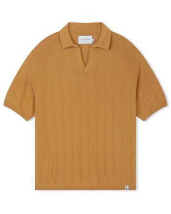 Image of model wearing Alma Polo shirt. 