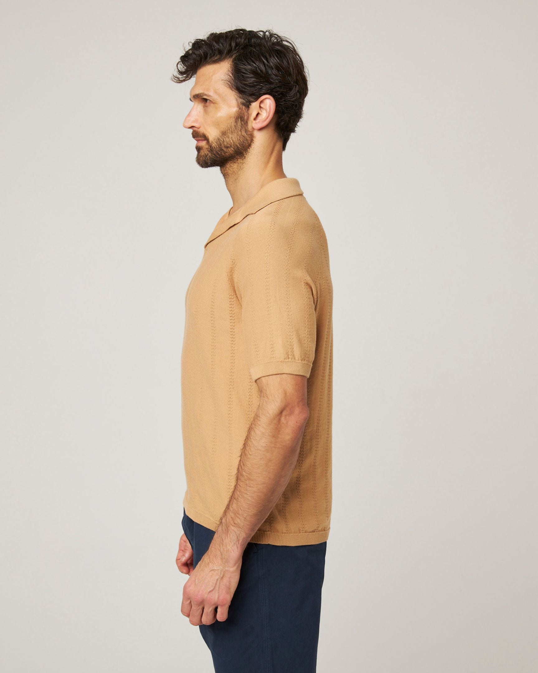 Image of model wearing Alma Polo shirt. 