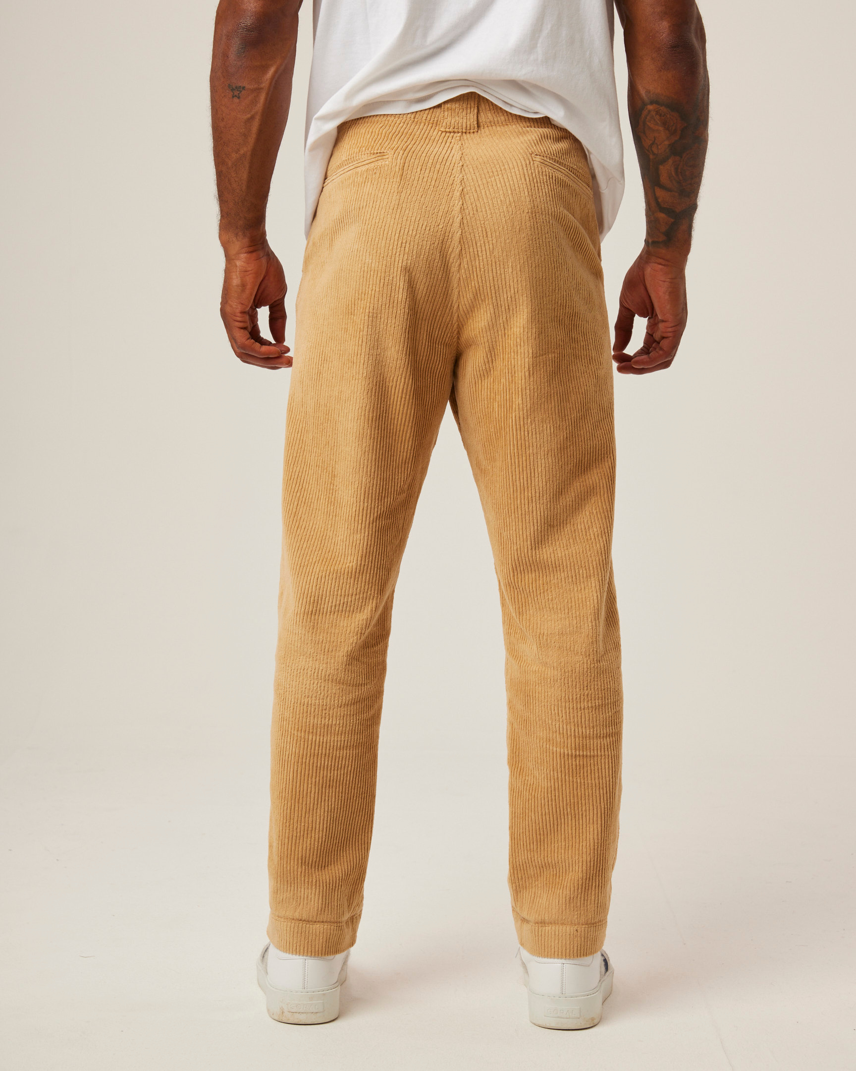 Image of model wearing Blake Corduroy Trousers. 