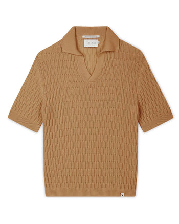 Image of model wearing Cove Polo Shirt. 